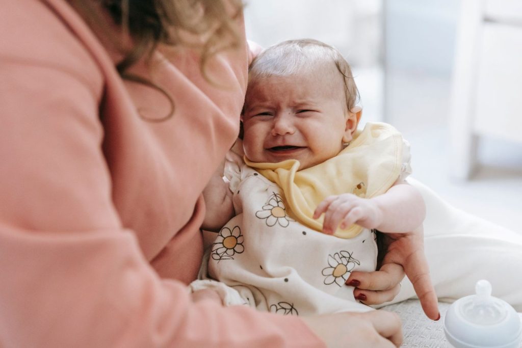 Mother comforting her crying baby