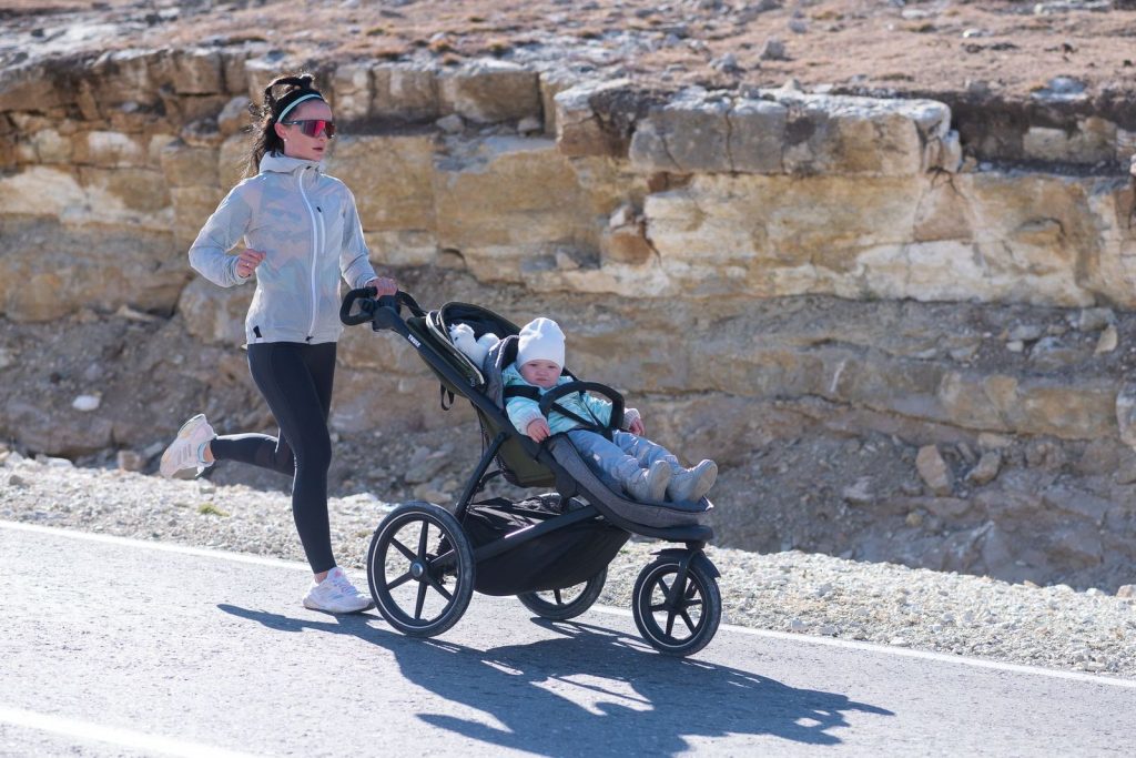 Woman running with a jogging stroller
