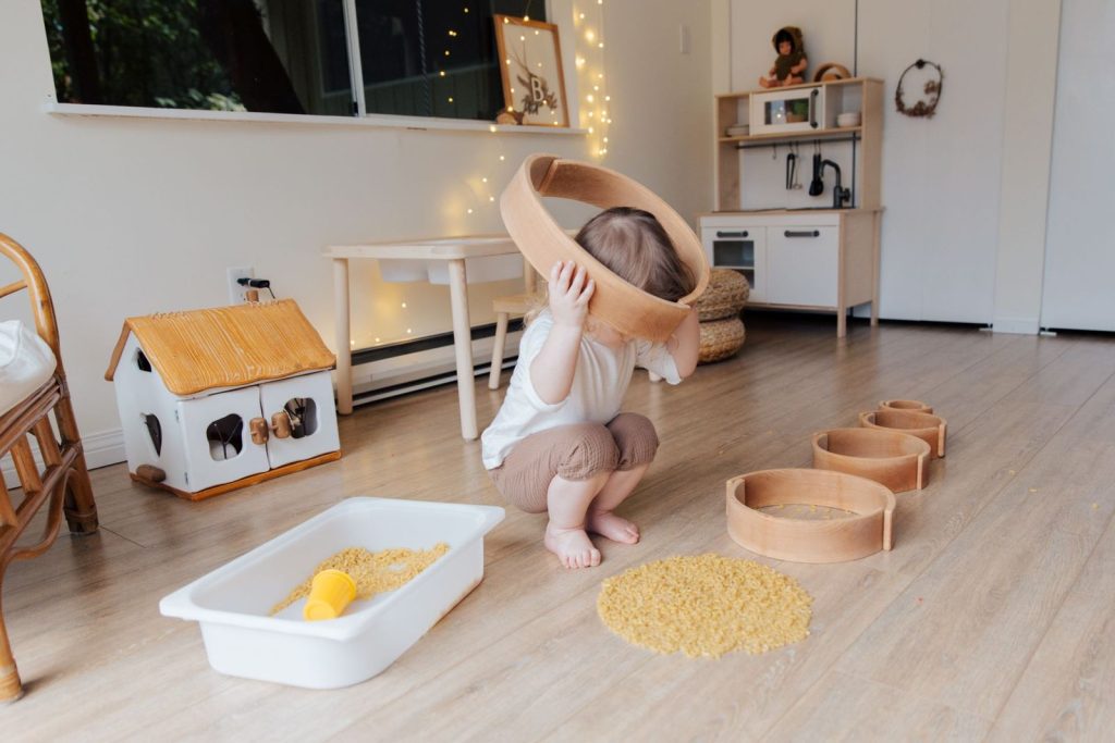 Toddler playing in a simple Montessori-style playroom